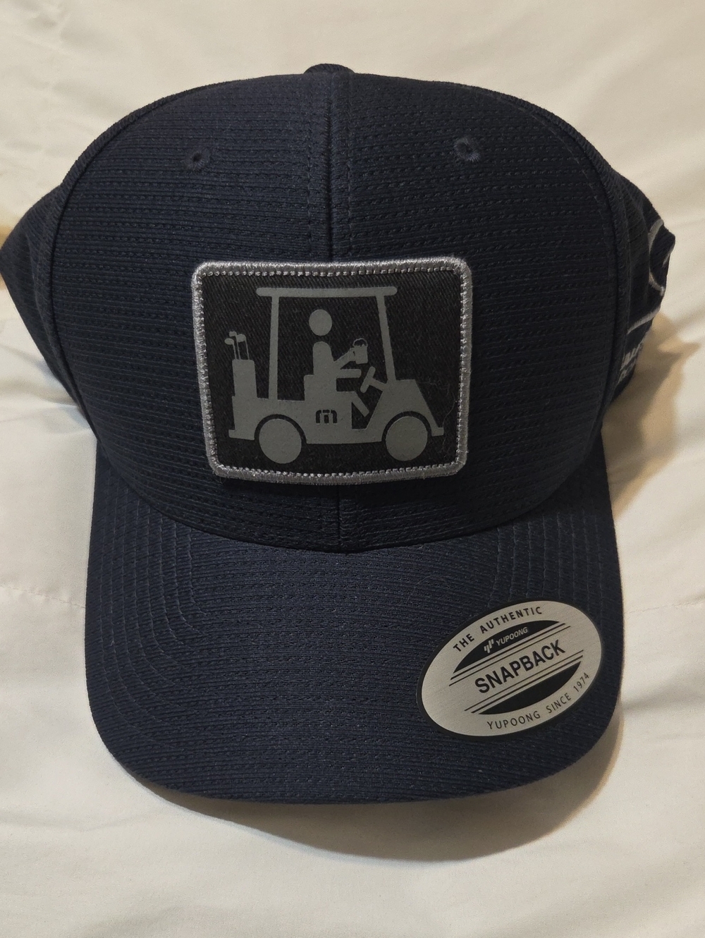 Travis Mathew Navy Snapback Hat with Golf Cart Patch